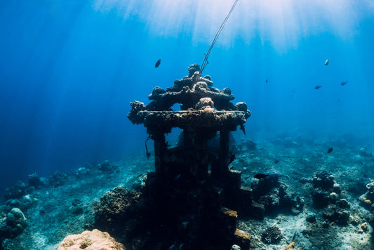 Diver exploring a reef in Amed Bali, a popular destination on a Bali diving trip