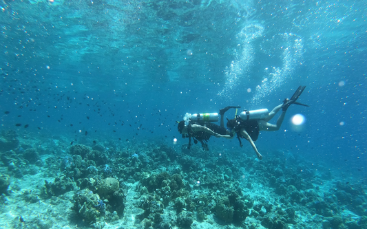 Diver preparing for PADI Advanced Open Water course in Bali with an instructor